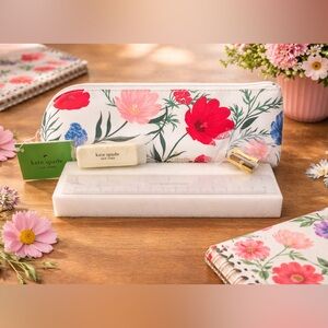Kate Spade floral pouch with red, pink, and blue blooms